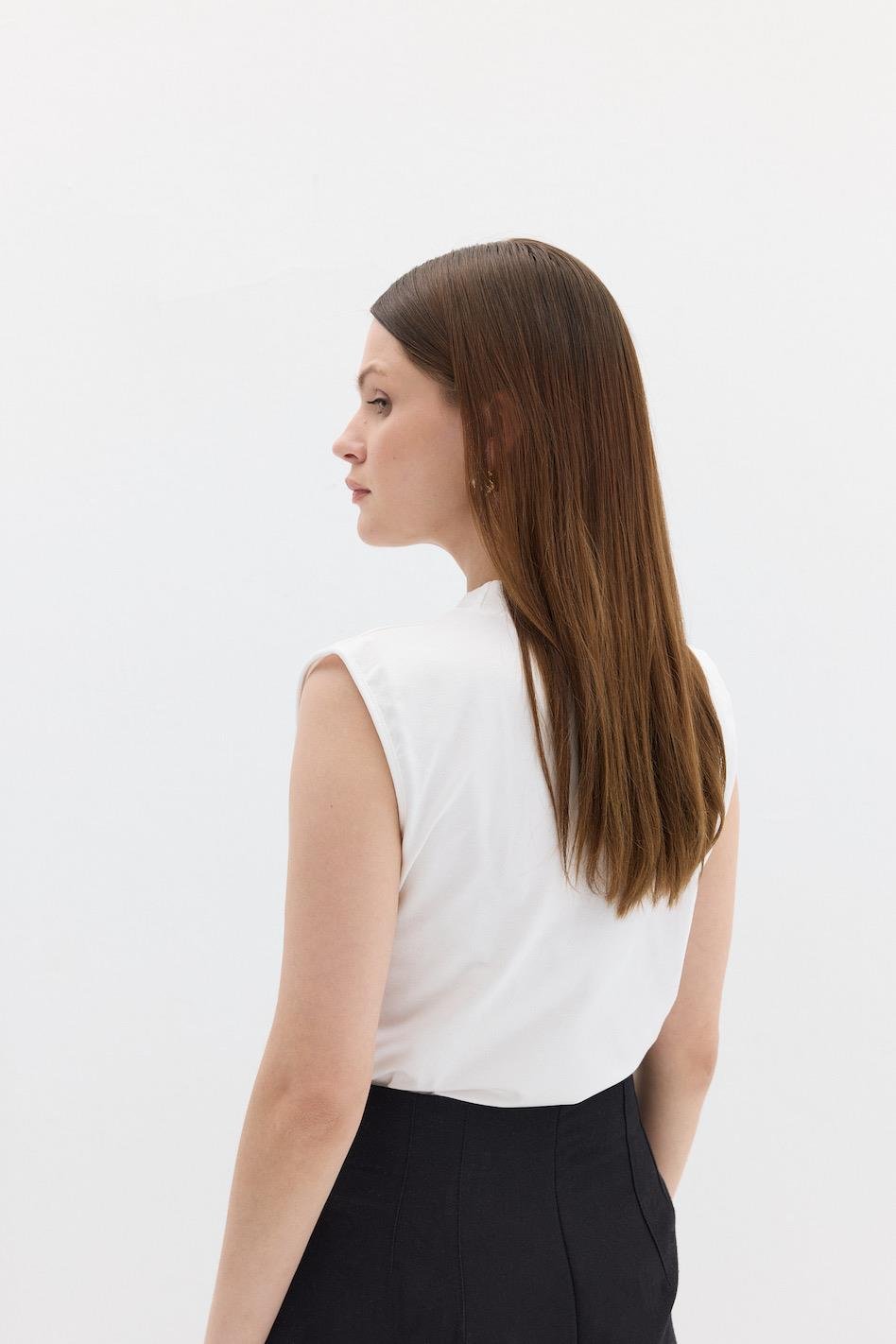 Nollärmad bodysuit vit