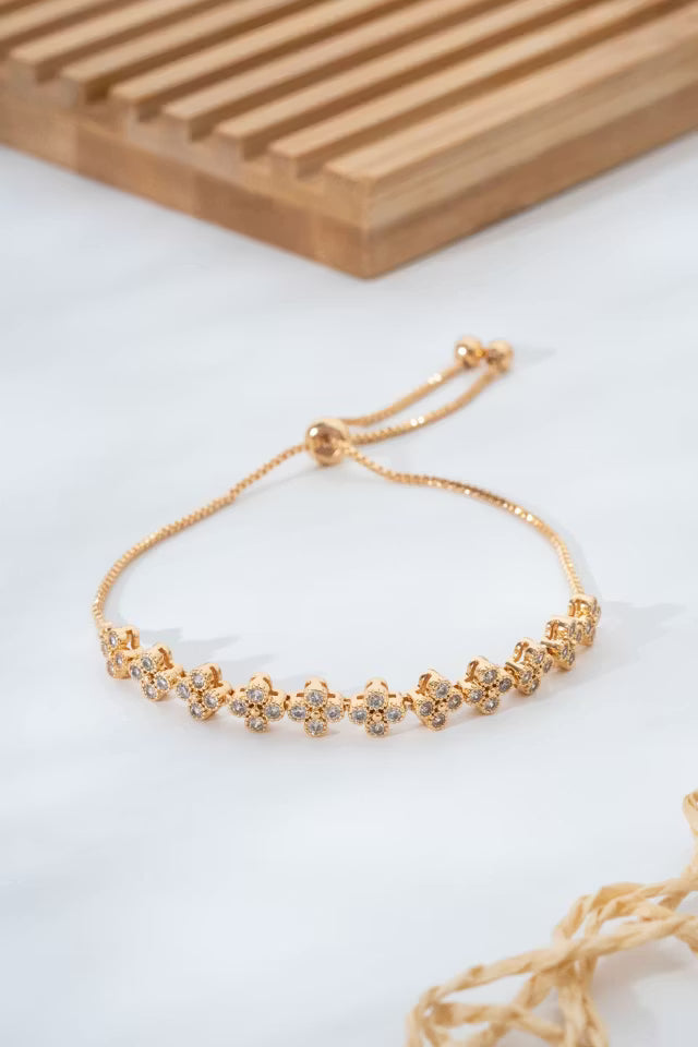 Justerbart guld VIP-armband med blommotiv