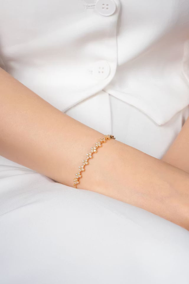 Justerbart guld VIP-armband med blommotiv
