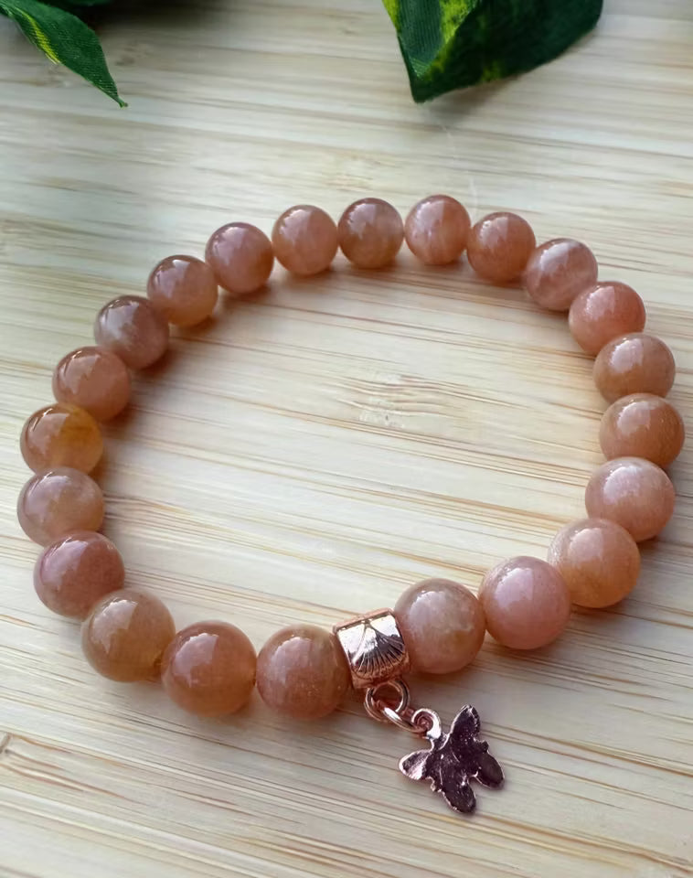 Solstens armband med fjäril